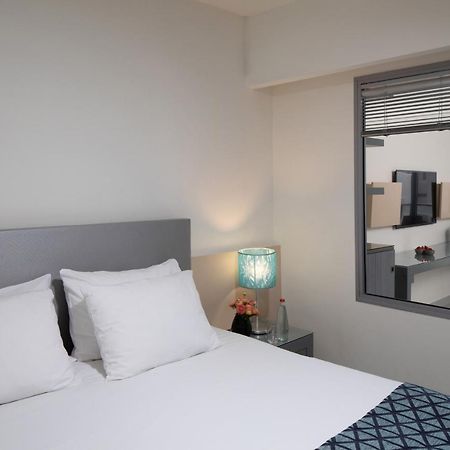 Neptune Eilat By Dan Hotels Ngoại thất bức ảnh A bedroom at the hotel